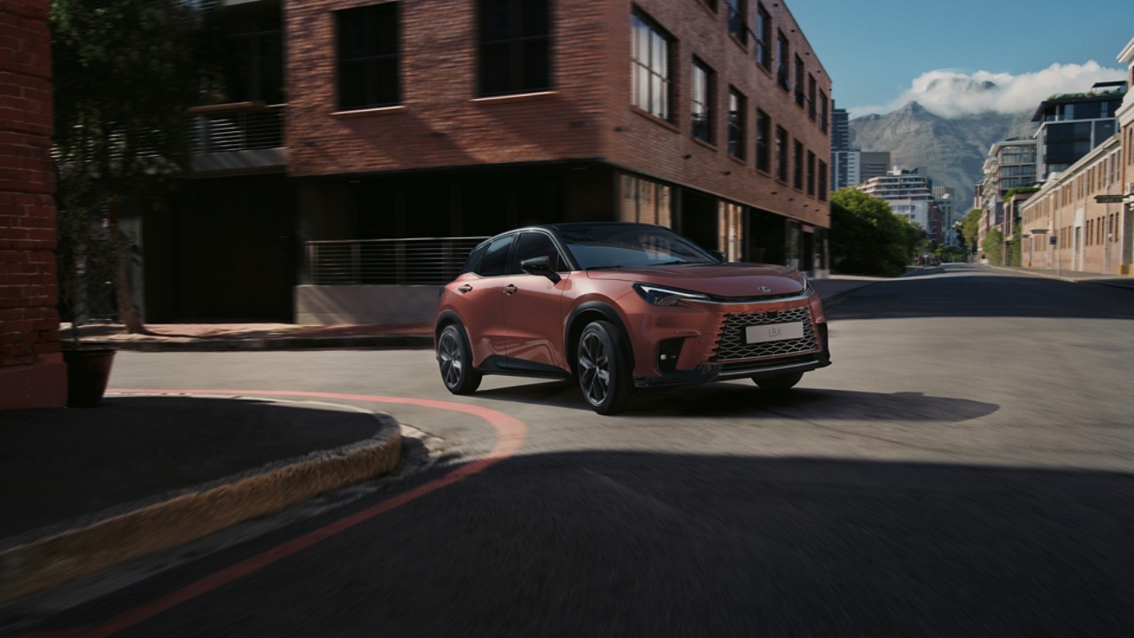 Lexus LBX driving in a town location